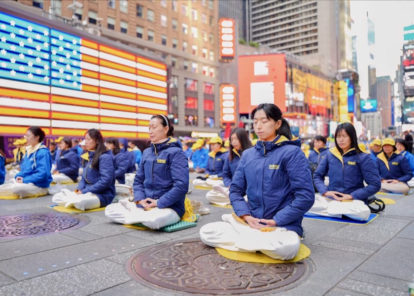 Image for article Peace and Serenity Prevail as Practitioners Do the Falun Dafa Exercises on Times Square